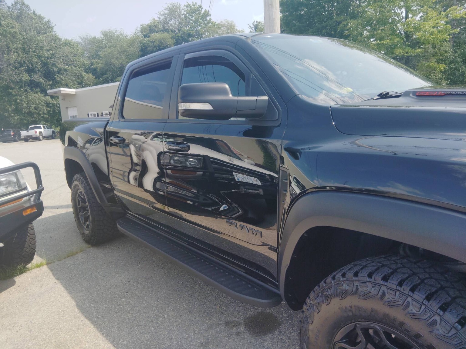 Black RAM truck glossy side profile after detailing