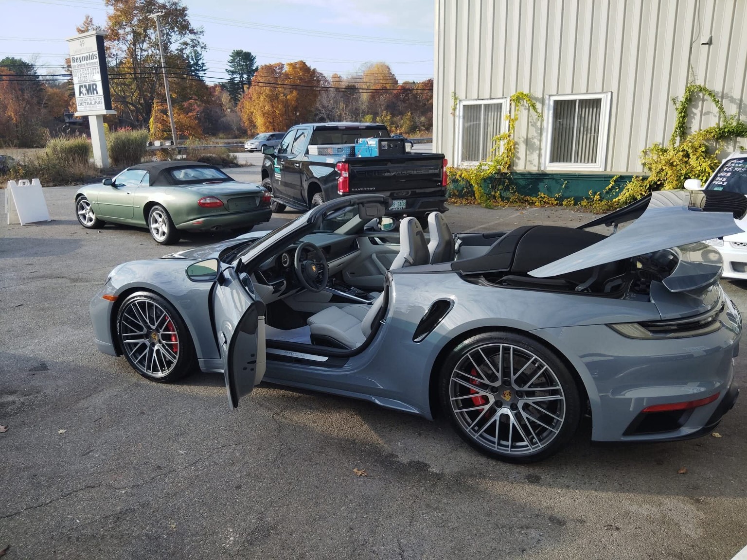 Blue Porsche 911 Turbo side profile — premium automotive detailing