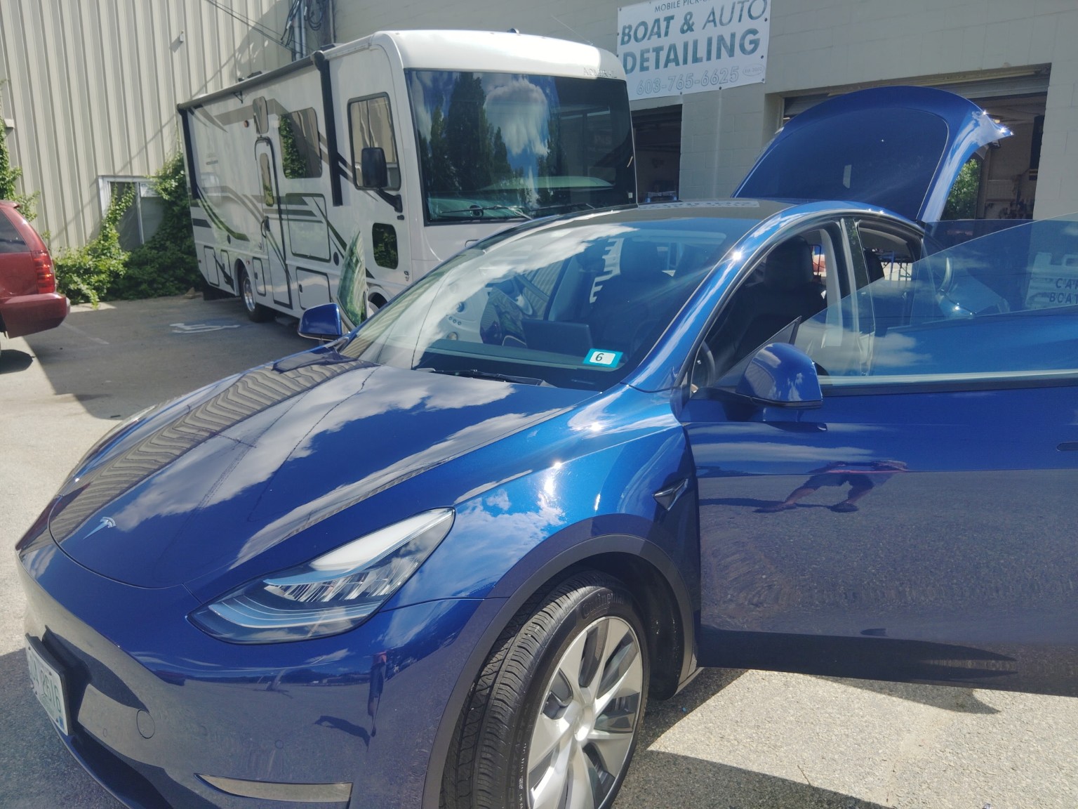 Blue Tesla after professional detailing