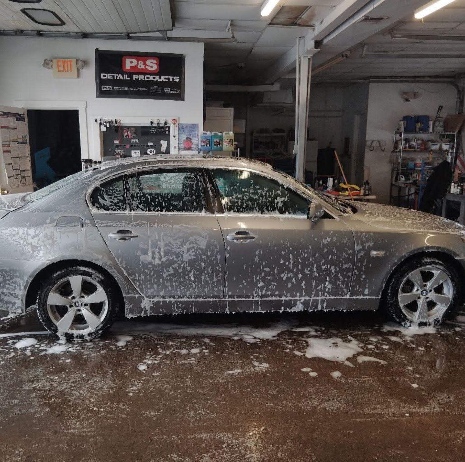 Silver BMW covered in foam before paint correction