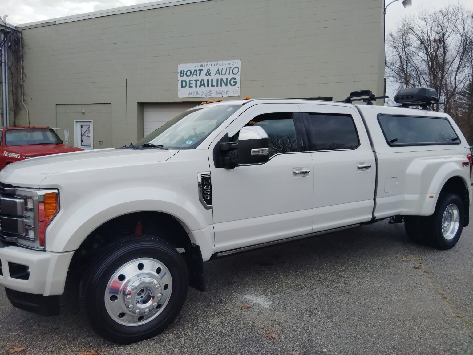 White heavy-duty dually truck front side after detailing