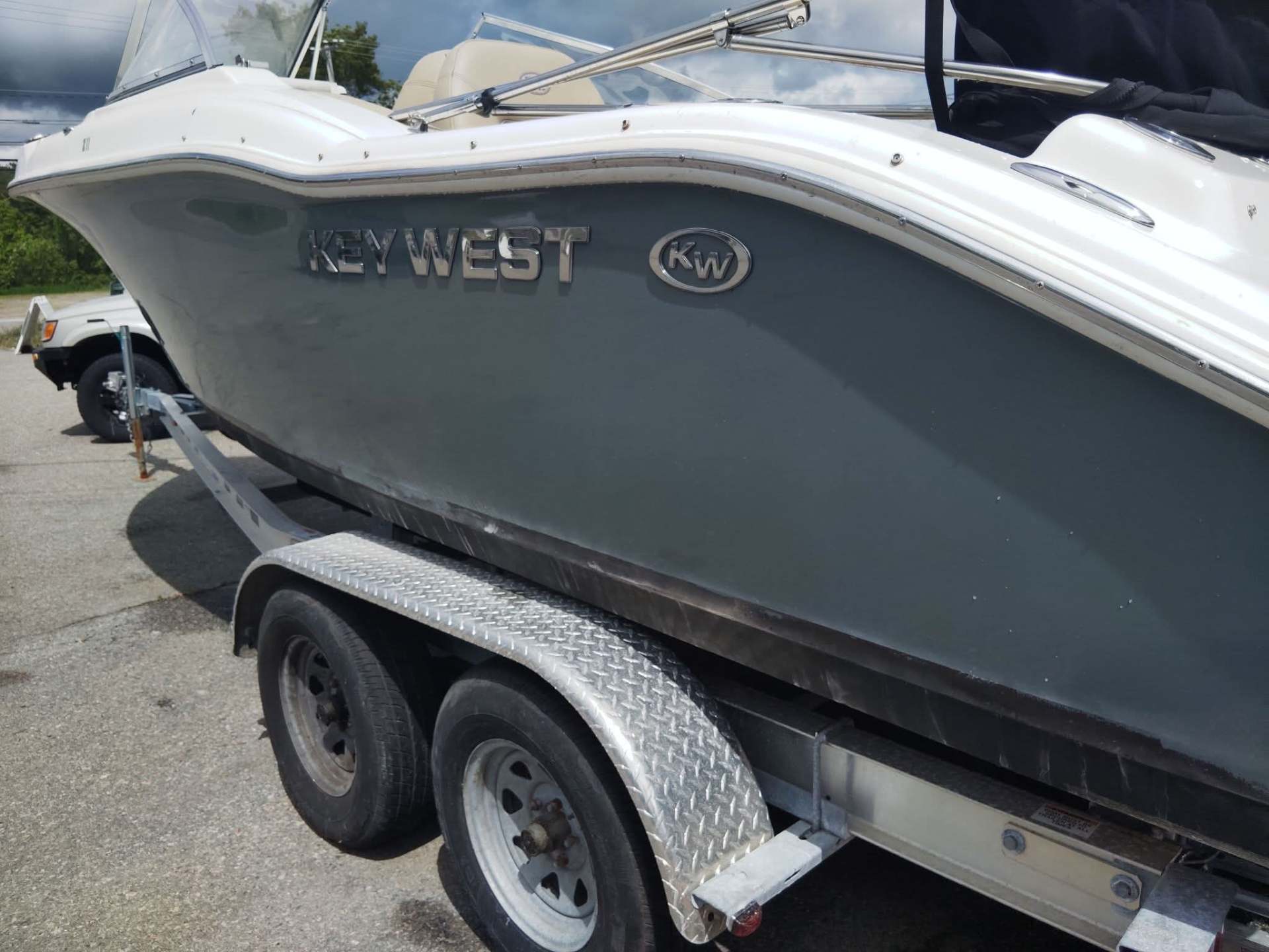 Key West center console boat after restoration — clean, refined, uniform hull finish